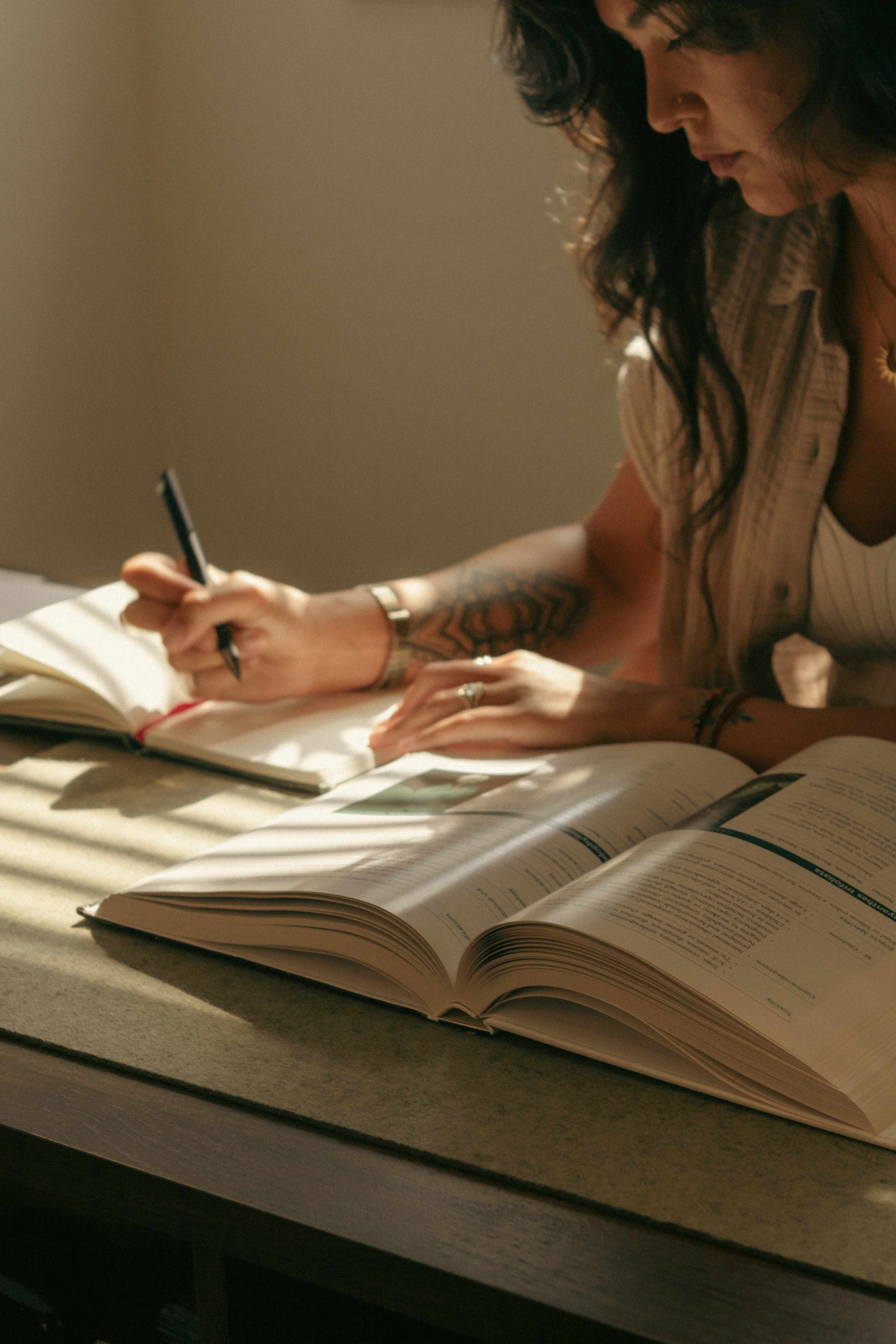 Naomi researching and taking notes